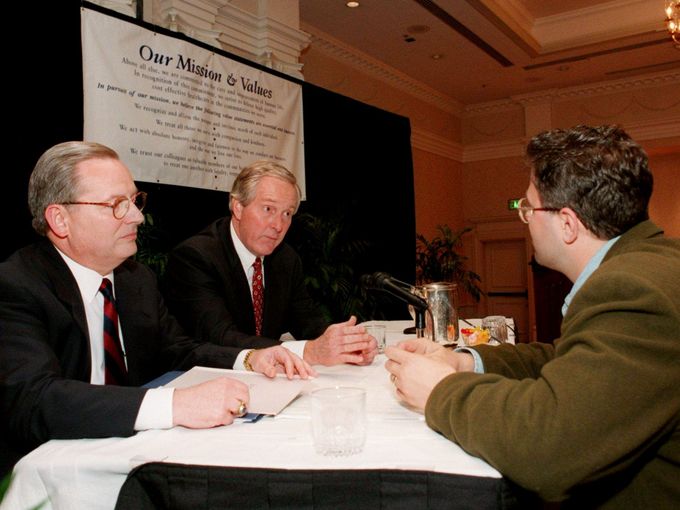 Columbia HCA President Jack Bovender, left, and Dr. Thomas Frist Jr. talk with shareholder Harry Van Buren at the end of the annual stockholders meeting in Nashville on May 14, 1998