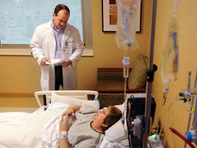 StoneCrest Medical Center pharmacist Matt McAllister talks with patient Mary Robin Brown Miller