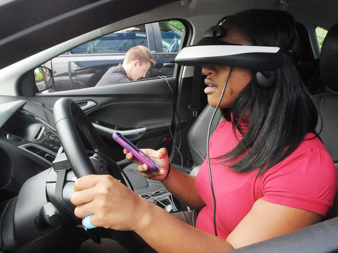 Fisk University sophomore and HCA intern Jianne McDonald participates in the texting simulator during AT&T's anti-texting and driving campaign